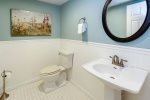 The powder room located near the recreation room is convenient.